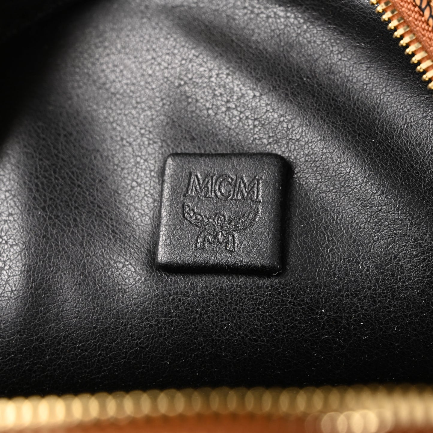 MCM Stark Visetos Medium Backpack – Cognac Monogram with Gold-Tone Studs