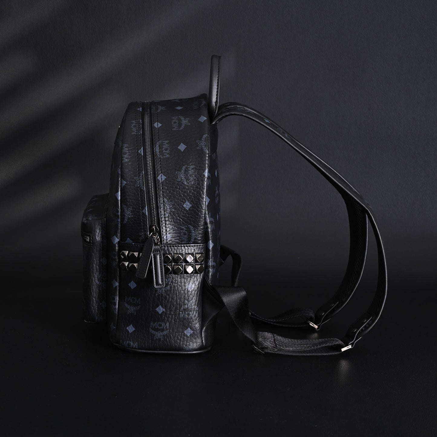 MCM Stark Visetos Medium Backpack – Black Monogram with Studded Detailing