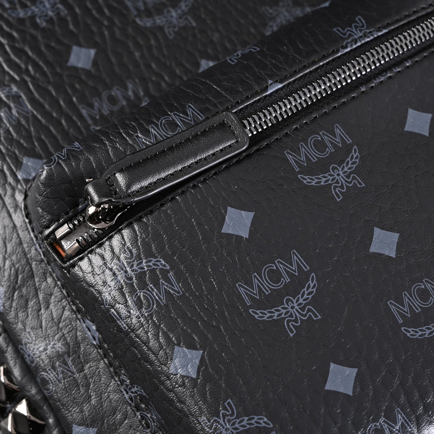 MCM Stark Visetos Medium Backpack – Black Monogram with Studded Detailing