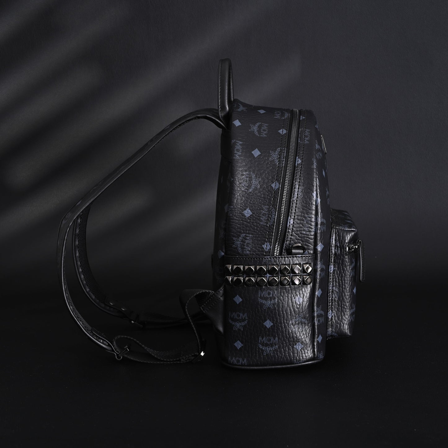 MCM Stark Visetos Medium Backpack – Black Monogram with Studded Detailing