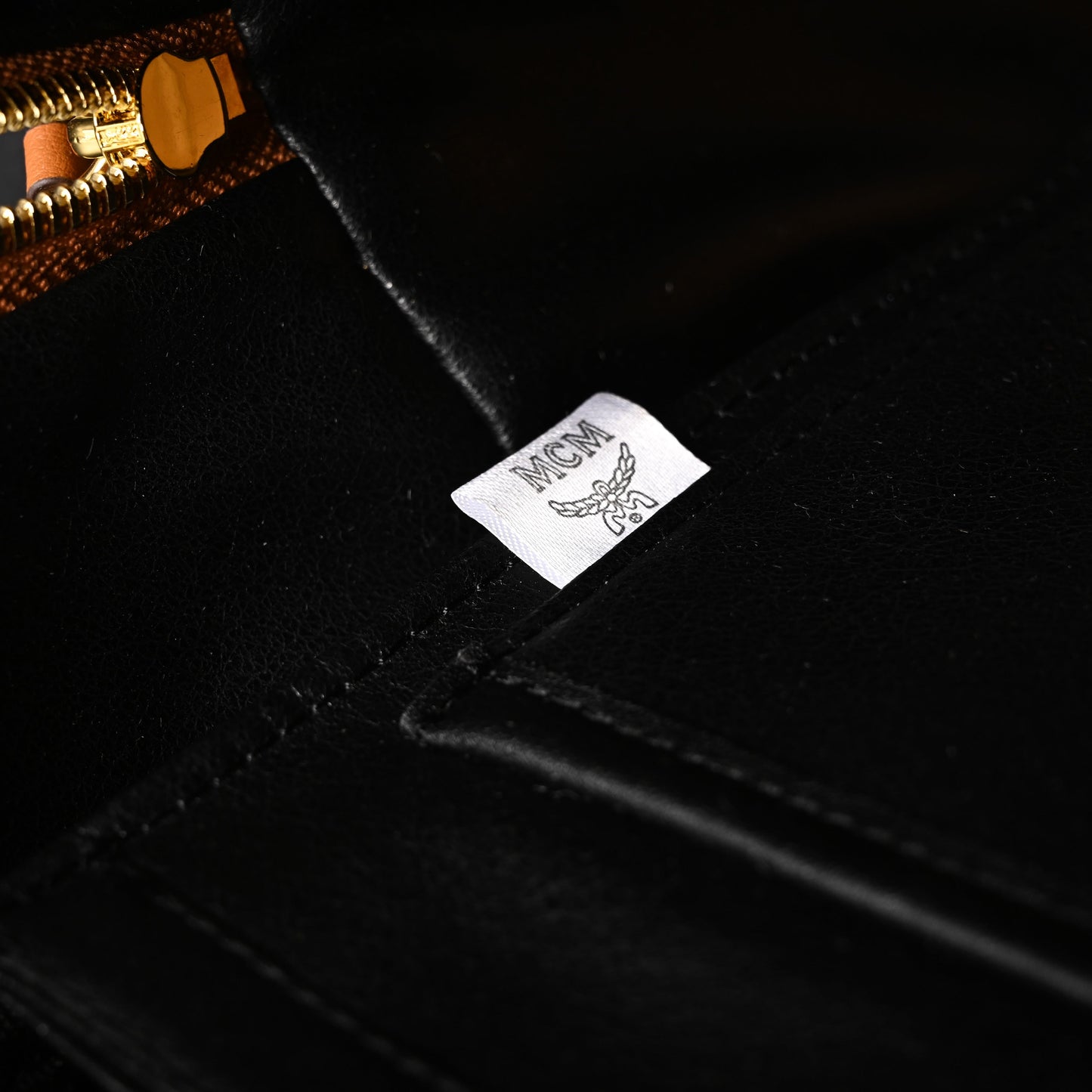 MCM Stark Visetos Medium Backpack – Cognac Monogram with Gold-Tone Studs